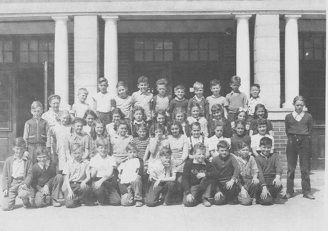 Lloyd George School, Grad 4-5, 1946-47 Miss Isabel Nixon - Top Row-Ron Jones, Barry Mayhew, Carmen Smith, Brian Corson, Don Campbell, David Hughes, ?, Peter Elder, Ken Lyons, Doug Takahashi.  3rd Row-Ron Hoover, Ruth Stokstad, Nadeanne Haines, ?, Jessie Chalmers, Marilyn Mclellan, Diana Day, Janet Moore, Donna Johnson, Linda Gough, ?.  2nd Row-Emma Comazetto, Margo Kenward, Arlene Corbin, Jeannie Barwell, Maureen Zart, ?, Jean Yallop, ?, Tina Ceci, Ruth Bann, Bev Ross (Standing.)  1st Row-Allen Fisher, Tom Roy, Larry Grant, John Ingham, ?, Jimmy Laird, Gary Whitmore, ?, Glen Whiteman, Wally Black