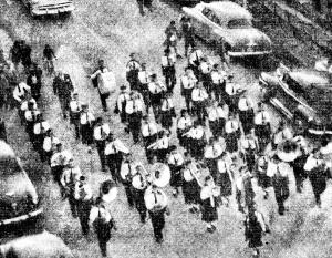 Parade down Victoria Street